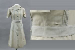 Uniform worn by Bullwinkel when she survived being shot. A bullet entry hole can be seen in the left side of the back bodice, the exit hole is located 35mm above the waist seam at the left center front.
