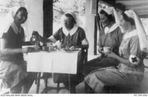 Bullwinkel, Matron Irene Drummond, M. Anderson, M. Selwood enjoy a cup of tea on the verandah of ward C1. The hospital was located in an unfinished mental hospital about seven miles north of Johor Bahru.