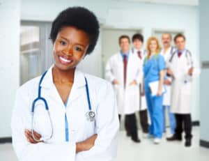 Medical doctor woman over health care background