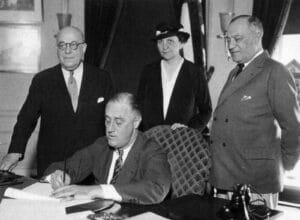 President Franklin Roosevelt signs the Act on July 5, 1935. 